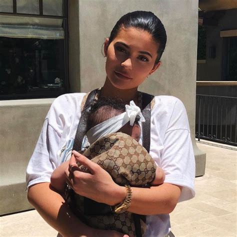 Kylie Jenner dresses Stormi in Gucci baby carrier